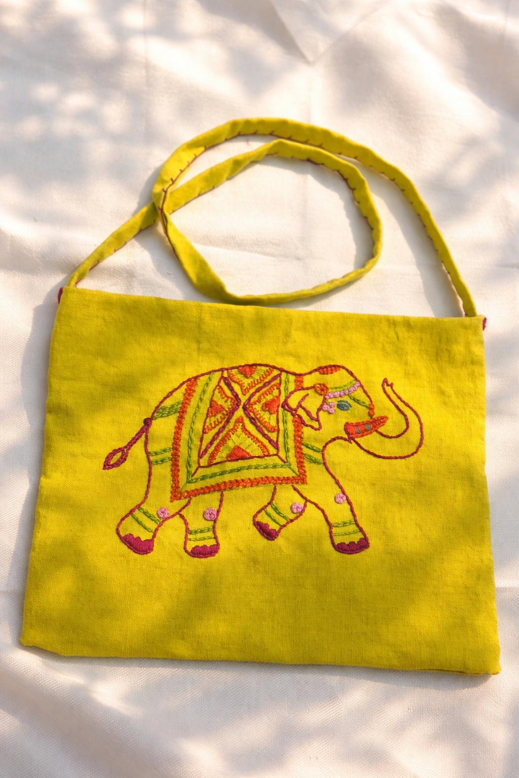 Yellow bag with an embroidered elephant design Gajraj heritage sling bag Anupriya’s Design